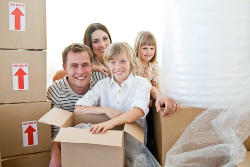 Experienced moving team handling commercial equipment safely